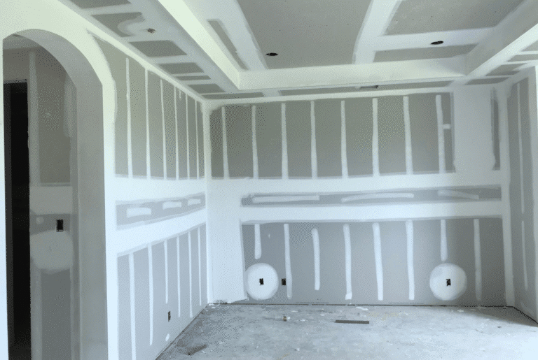 drywall installation with taped seams and tray ceiling detail ready for finish coat and paint in central iowa